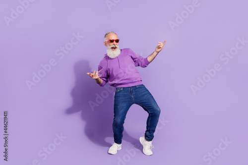 Full length body size view of attractive cheerful trendy grey-haired man guy dancing rest relax isolated over purple violet color background