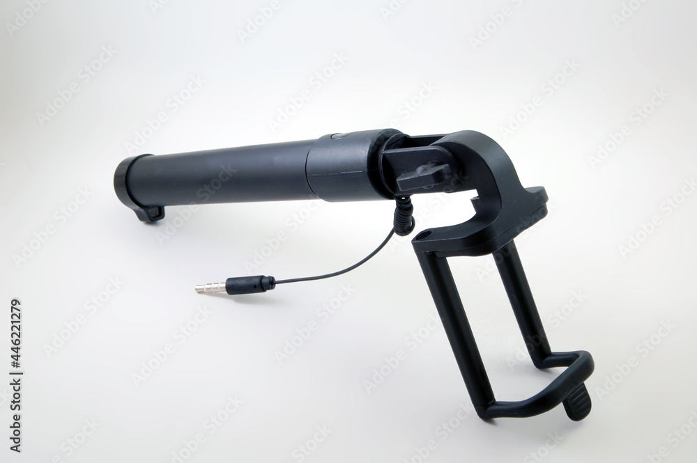 Black selfie stick with shutter button