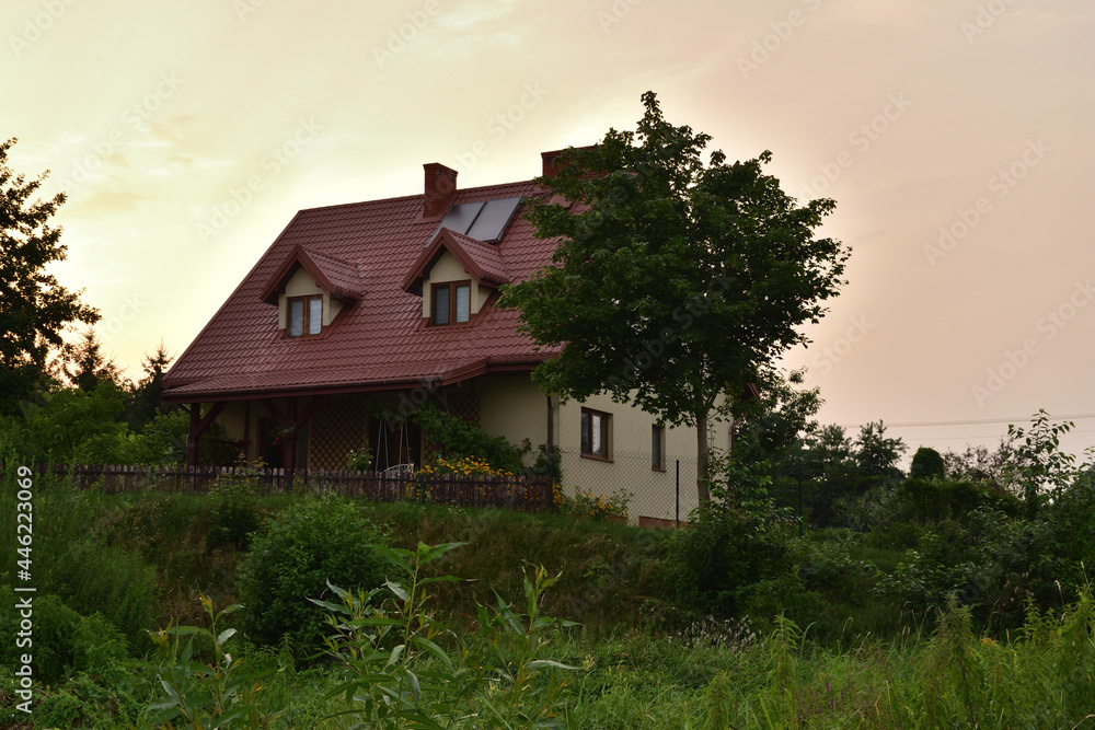 The house on the hill is covered with trees. Evening, Gloomy. The house on the hill is covered with trees. Evening, Gloomy.