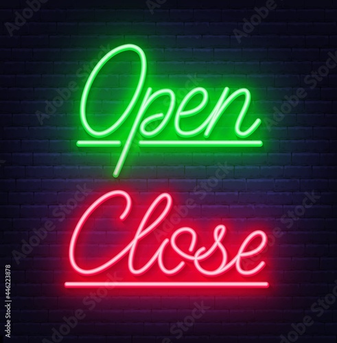 Neon sign open and close on brick wall background.
