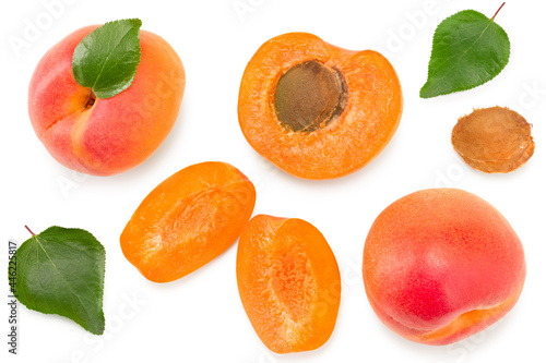 apricot fruits with slices and green leaf isolated on white background. clipping path. top view