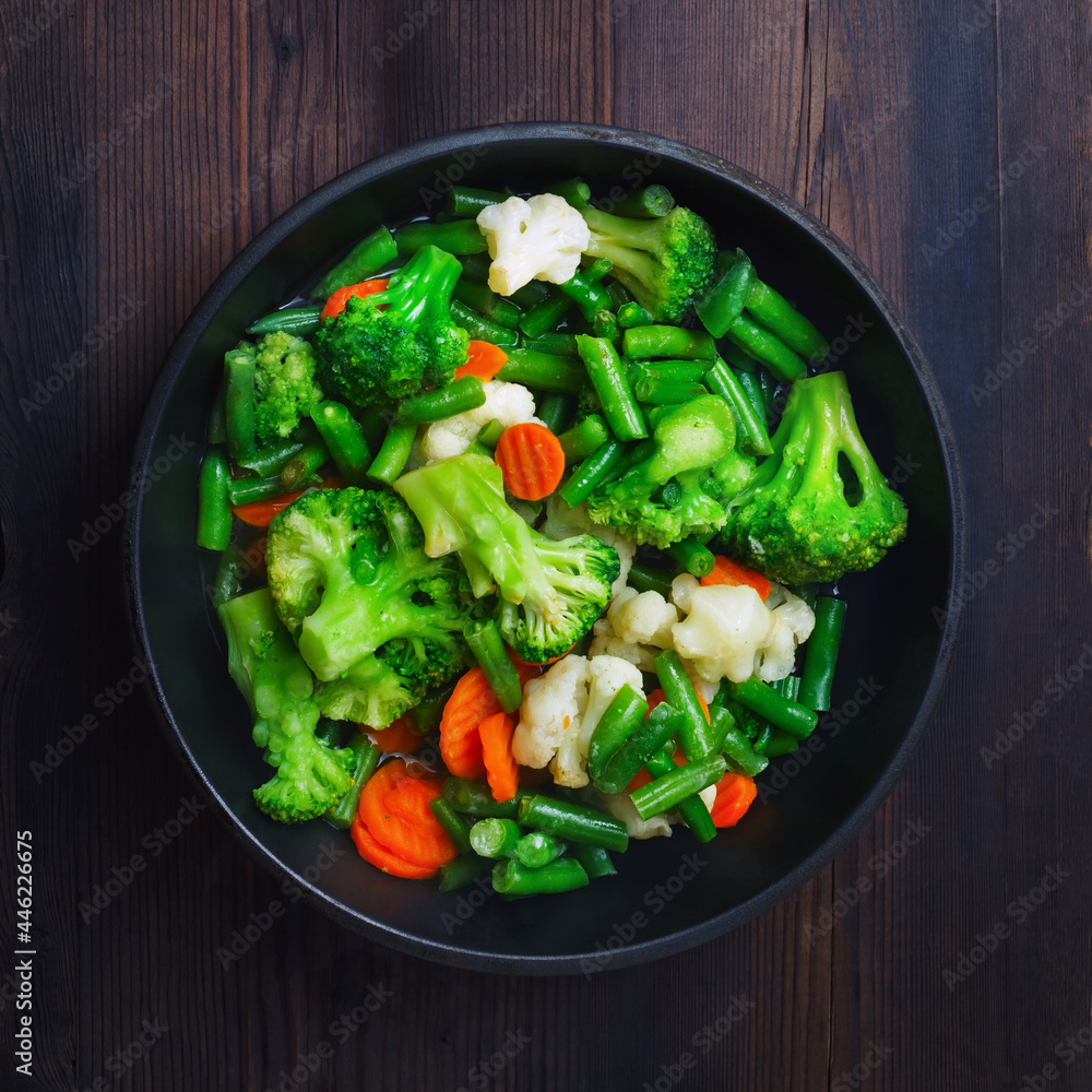 Grilled vegetables in pan on wooden background. Top view. Flat lay. Grilled vegetables in pan on wooden background. Top view. Flat lay.