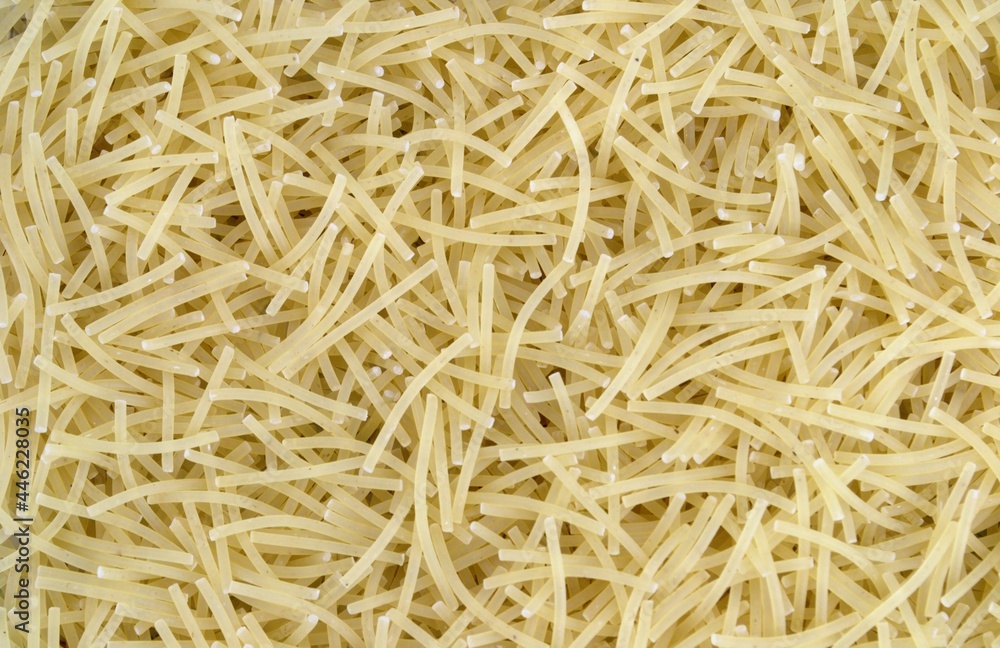 Dry flour noodles are neatly laid out