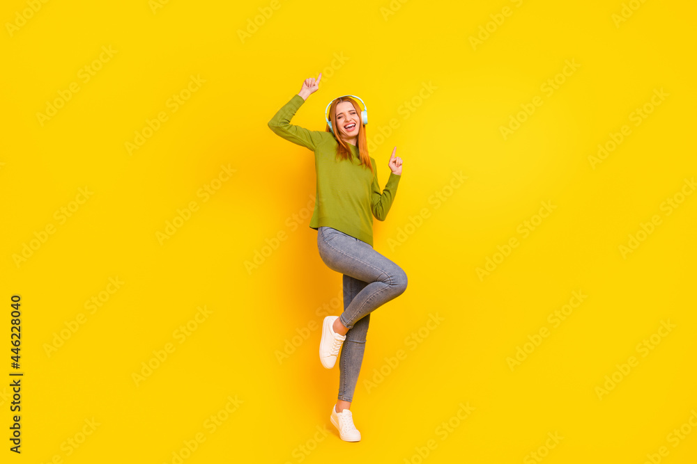 Full length body size photo dancing in headphones girl in casual clothes isolated vibrant yellow color background