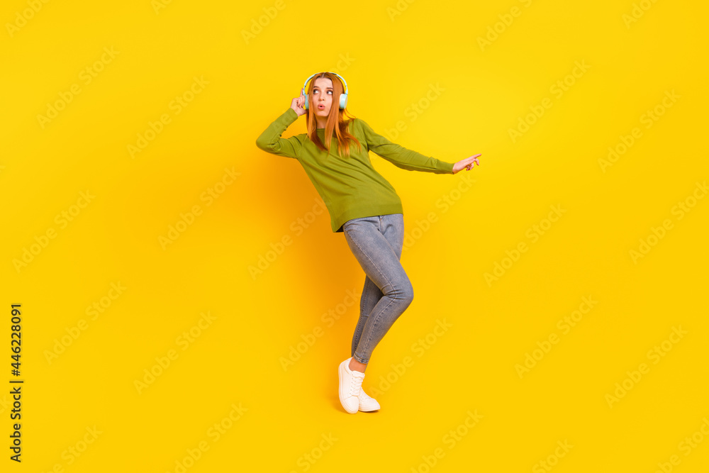 Full length body size photo dancing in earphones girl in casual outfit isolated vibrant yellow color background