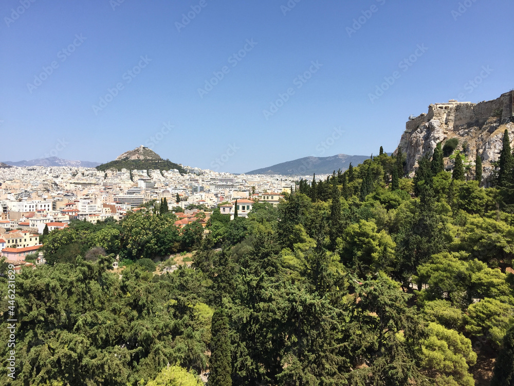 View of the Parthenon on the Athenian Acropolis and Mount Lycabettus, seen from the Areopagus Hill in Athens, Greece.
