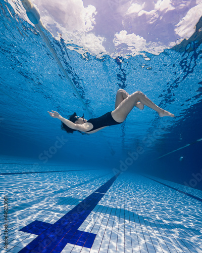 woman floating underwater
