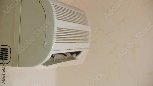 Old Split Air Conditioner Start Blowing To Cool Down Temperature In Office while there is a heat outside