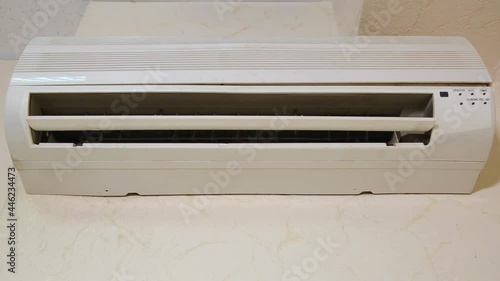 Old Split Air Conditioner Start Blowing To Cool Down Temperature In Office while there is a heat outside