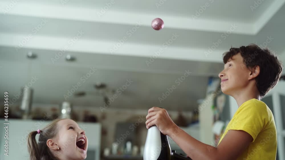 Curious boy and girl conducting a physical experiment called "floating