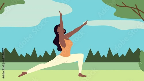 brunette woman practicing yoga in the field photo