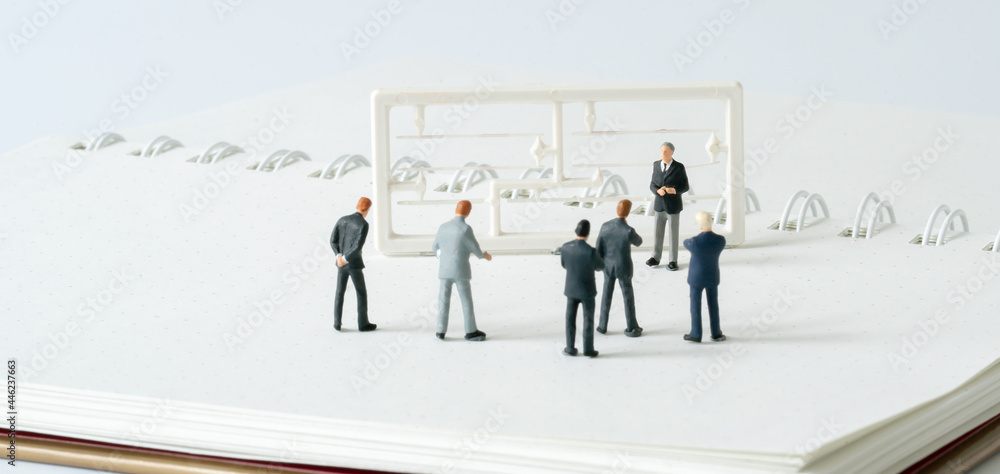 Miniature people A Businessman speech presentation on public stage on white background using as Success Business Due and New Technology product announcement partnership business development cover page Miniature people A Businessman speech presentation on public stage on white background using as Success Business Due and New Technology product announcement partnership business development cover page