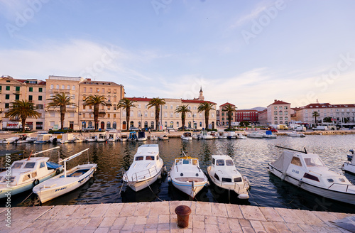 Travel by Croatia. Beautiful landscape with Split Old Town harbor on sea shore at sunrise time.