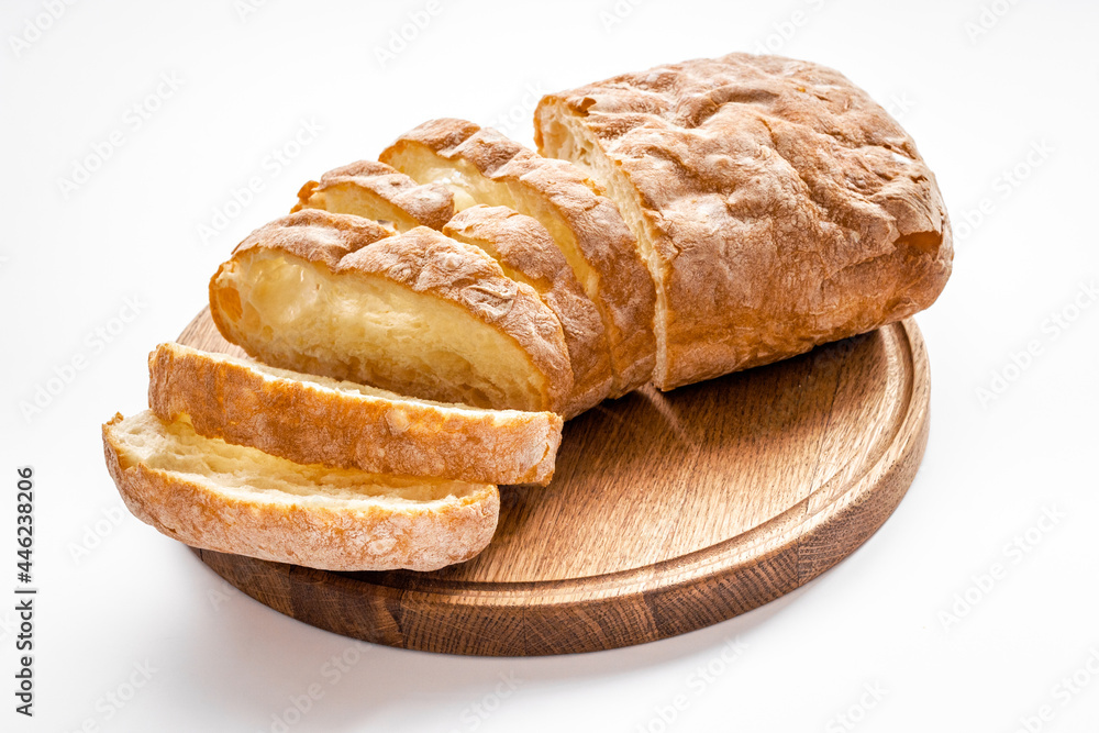 Fresh bread ciabatta loaf close up. Bakery background Fresh bread ciabatta loaf close up. Bakery background