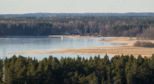 Aerial view of Usma lake in sunny winter evening without snow  Latvia.