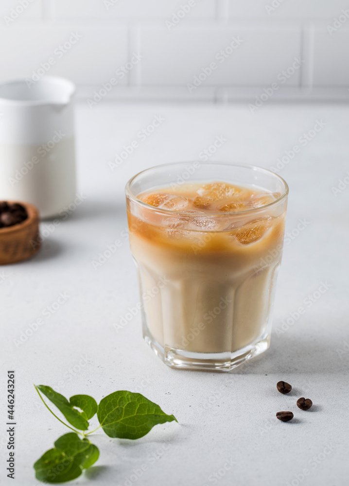 Cold coffee with ice and cream on a white background. Homemade cold latte. Cold coffee with ice and cream on a white background. Homemade cold latte.