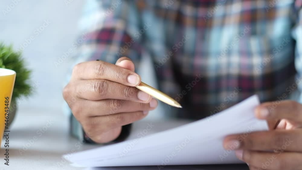 man hand with pen analyzing financial chart on paper man hand with pen analyzing financial chart on paper