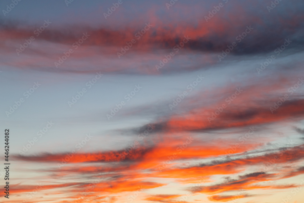 Red orange clouds on the sunrise sky.