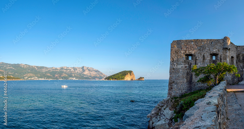 Summer seascape with turquoise water of Adriatic sea and Sveti Nikola island from Budva city in Montenegro.