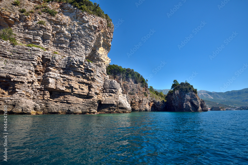 Picturesque view of the cliffs from the sea. Budva riviera, Montenegro
