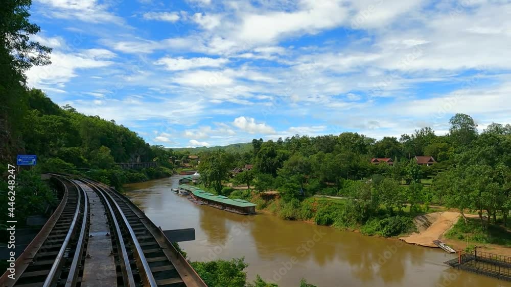 Death Railway Amazing Train on The Bridge of the River Kwai at Kanchanaburi amazing Thailand. Traveling after unlocking the Covid-19 situation in Thailand. Aerial view slide and pan. Death Railway Amazing Train on The Bridge of the River Kwai at Kanchanaburi amazing Thailand. Traveling after unlocking the Covid-19 situation in Thailand. Aerial view slide and pan.