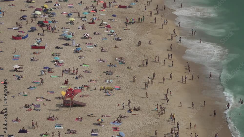People use colorful umbrellas and swim in the sea on the popular beach of Nazare, after coronavirus lockdown measures are eased in Portugal
People use colorful umbrellas and swim in the sea on the popular beach of Nazare, after coronavirus lockdown measures are eased in Portugal