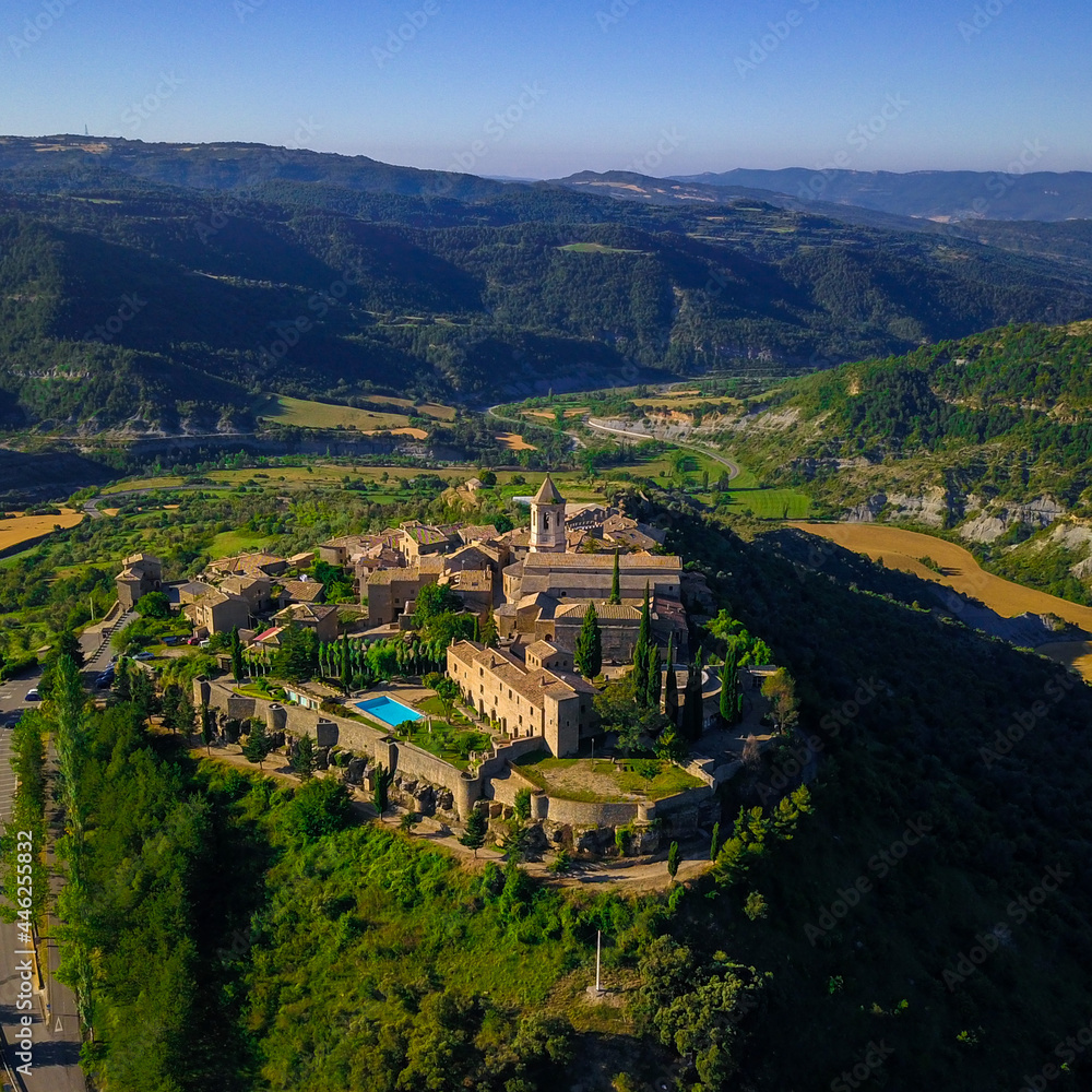 Aerial view of the typical spanish old village in the middle of the mountains.