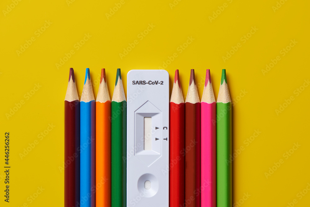 covid-19 antigen diagnostic test device and colored pencils covid-19 antigen diagnostic test device and colored pencils