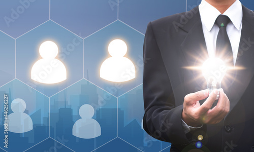 Business man black suit select Choice employee human resource system technology. hold idea lamp lifgt concept idea.