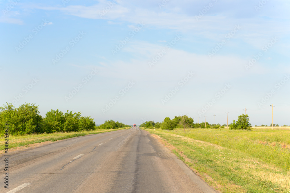Naklejka premium An asphalt road outside the city. View from the car.