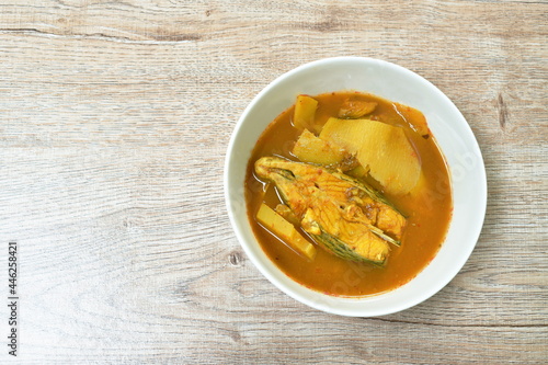 boiled red mango fish with pickled bamboo shoot in spicy and sour soup on bowl
