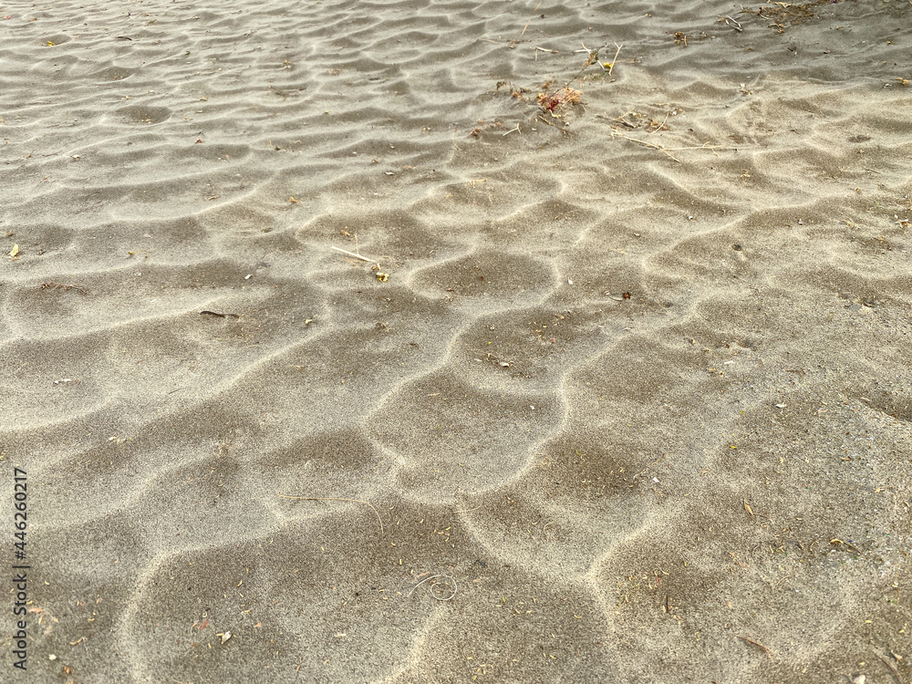 beach wind blown sandy dune dirt blowing earth pattern with shadows