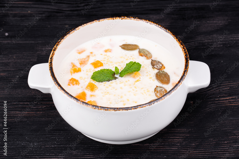 millet porridge, with pumpkin, milk, butter, pumpkin seeds millet porridge, with pumpkin, milk, butter, pumpkin seeds