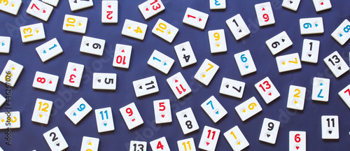 Top view of rummikub tiles, isolated on black background. photo