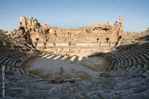Ruins of the ancient amphitheater in Perge. Perge theatre was constructed in the Greco-Roman style. Perge is an ancient Greek city in Antalya on the southern Mediterranean coast of Turkey. photo