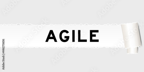 Ripped gray paper that have word agile under torned part