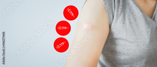 senior woman showing  her arm with bandage after got vaccinated or inoculation three dose or booster dose due to spread of corona virus, population, social or herd immunity concept photo