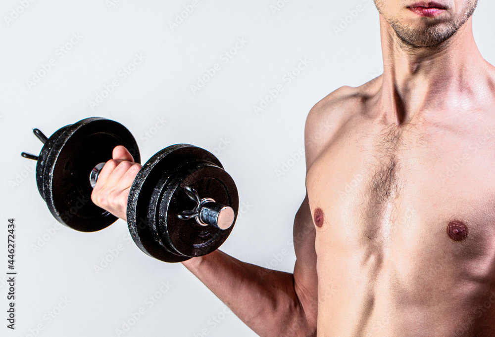 Weak man lift a weight, dumbbells, biceps, muscle, fitness. Nerd maleraising a dumbbell. Man holding dumbbell in hand. Skinny guy hold dumbbells up in hands. A thin man in sports with dumbbells Weak man lift a weight, dumbbells, biceps, muscle, fitness. Nerd maleraising a dumbbell. Man holding dumbbell in hand. Skinny guy hold dumbbells up in hands. A thin man in sports with dumbbells