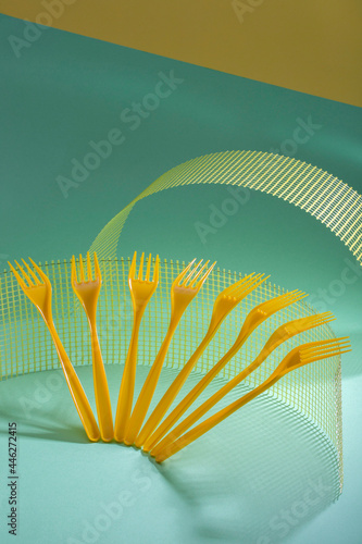 Abstract still life with yellow forks on a colorful background