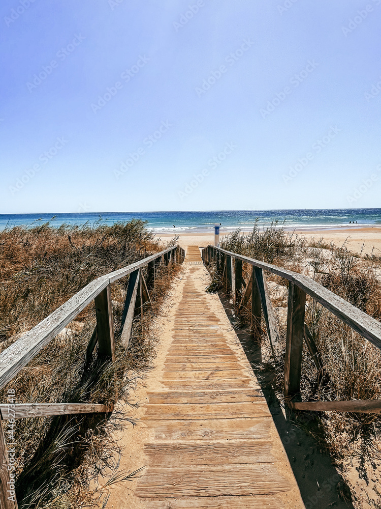 Wooden bridge towards the beach