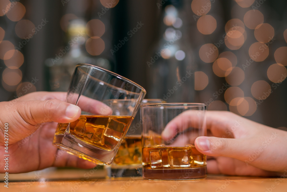Celebrate whiskey on a friendly party in restaurant.