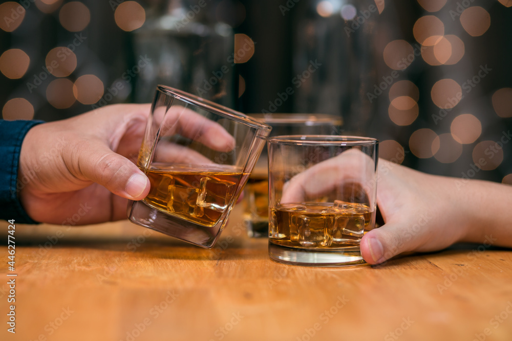 Celebrate whiskey on a friendly party in  restaurant.