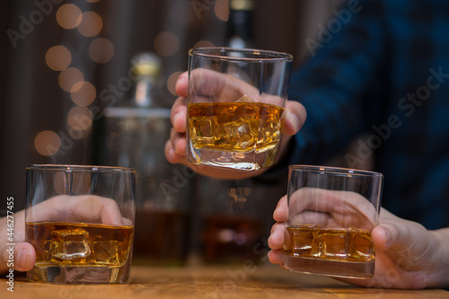 Celebrate whiskey on a friendly party in restaurant.