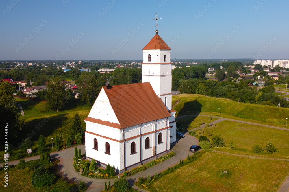 Aerial view of a medieval European church with Romanesque architecture
