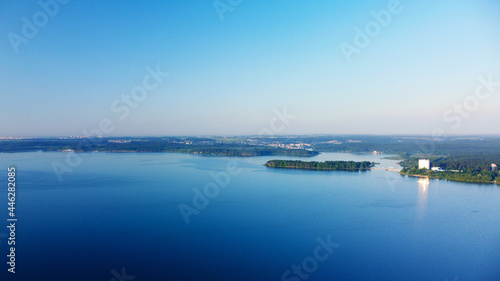 Aerial view of blue lake water landscape at sunrise