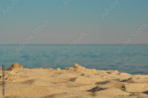 Empty beach on the sea in summer with golden yellow sand