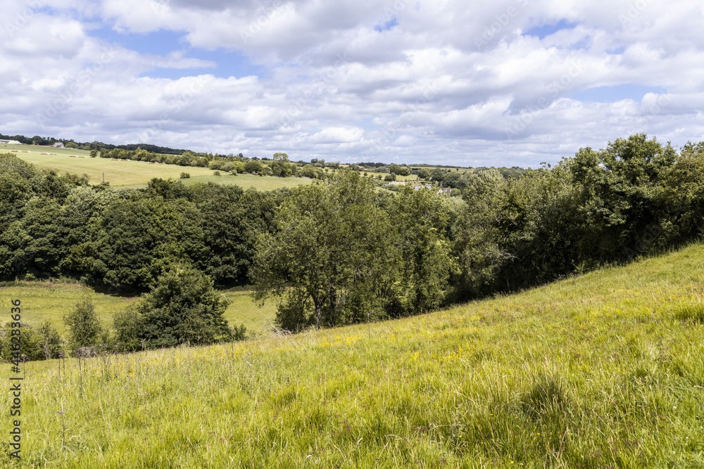 The valley of the River Windrush near the Cotswold village of Naunton, Gloucestershire UK