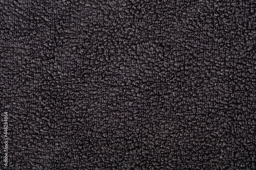 Black towel texture background © andersphoto