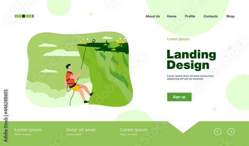 Climber hanging on rope and pulling himself on top of rocky mountain wall. Extreme mountaineer climbing on cliff. For sport, outdoor activity, risk, alpinist concept