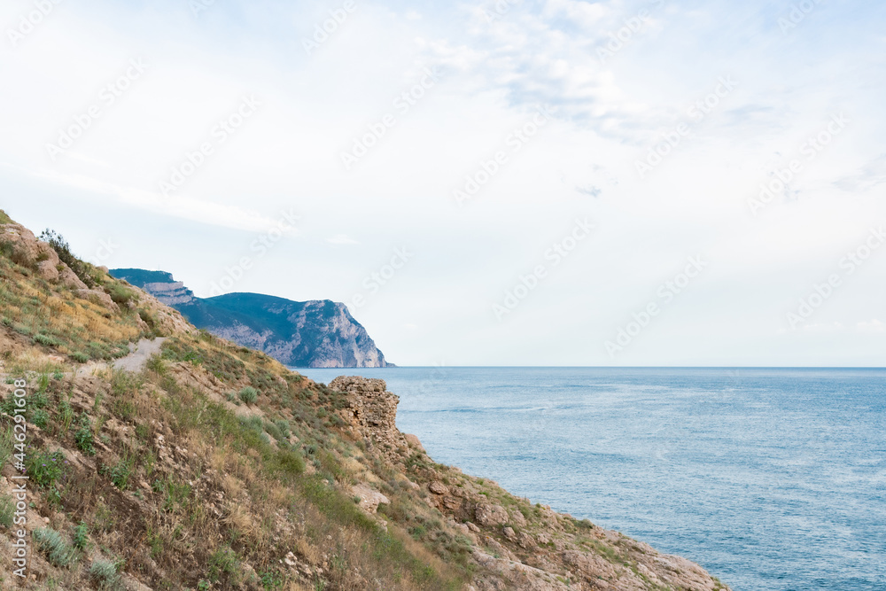 Fototapeta premium Rock in the sea bay. Sea bay rock view. Landscape of sea bay 